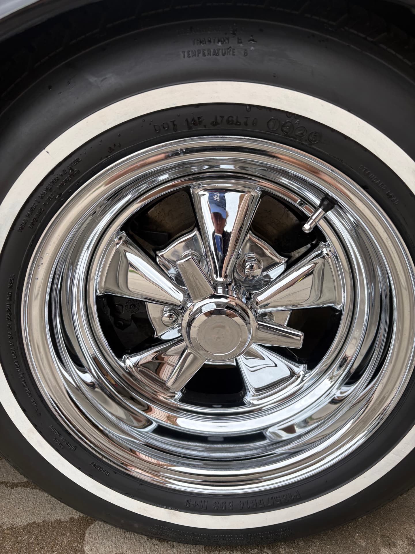 Whitewall tire and chrome wheel after detailing